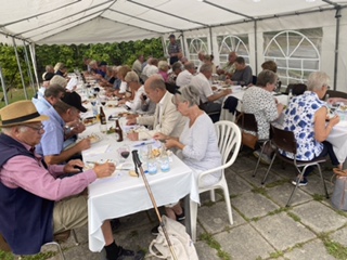 black and white sailboat in body of water during sunset